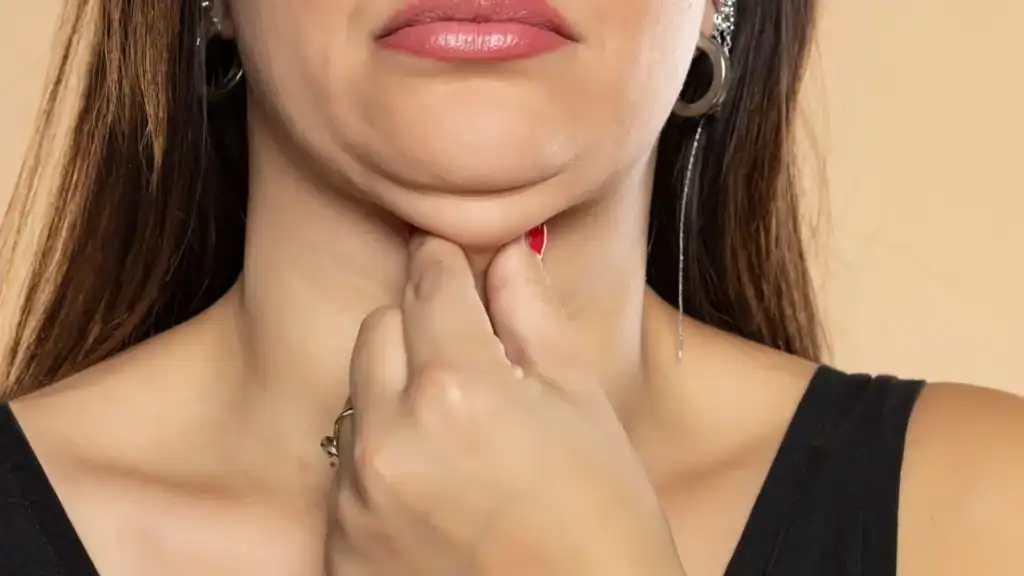 An image of a woman with double chin, sad, worried : Non Surgical Double Chin Removal Treatment in Craigentinny, UK